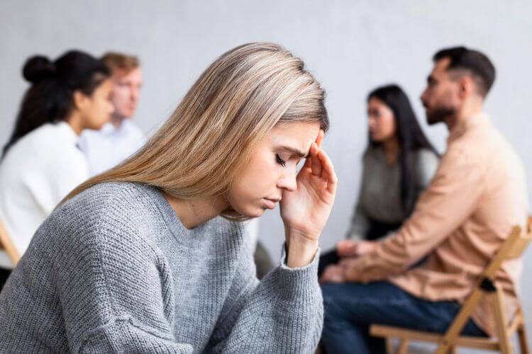 At a social gathering, a girl suffering from anxiety