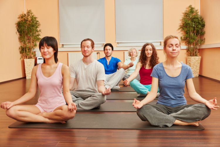 People meditate at an addiction recovery center